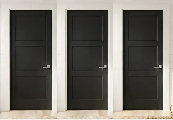 Velluto Boutique fitting room doors in matte black with warm ivory walls
